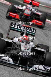 09.05.2010 Barcelona, Spain,  Michael Schumacher (GER), Mercedes GP Petronas, W01 leads Jenson Button (GBR), McLaren Mercedes, MP4-25 - Formula 1 World Championship, Rd 5, Spanish Grand Prix, Sunday Race