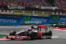 09.05.2010 Barcelona, Spain,  Jenson Button (GBR), McLaren Mercedes, MP4-25 leads Michael Schumacher (GER), Mercedes GP Petronas - Formula 1 World Championship, Rd 5, Spanish Grand Prix, Sunday Race