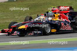 09.05.2010 Barcelona, Spain,  Lucas di Grassi (BRA), Virgin Racing, Sebastian Vettel (GER), Red Bull Racing and Lewis Hamilton (GBR), McLaren Mercedes goes out of the pits  - Formula 1 World Championship, Rd 5, Spanish Grand Prix, Sunday Race