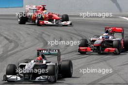 09.05.2010 Barcelona, Spain,  Michael Schumacher (GER), Mercedes GP Petronas leads  W01, Jenson Button (GBR), McLaren Mercedes, MP4-25 - Formula 1 World Championship, Rd 5, Spanish Grand Prix, Sunday Race