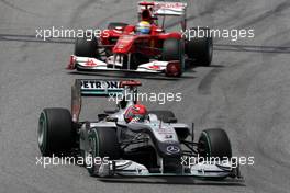 09.05.2010 Barcelona, Spain,  Michael Schumacher (GER), Mercedes GP Petronas, W01 leads Felipe Massa (BRA), Scuderia Ferrari, F10 - Formula 1 World Championship, Rd 5, Spanish Grand Prix, Sunday Race