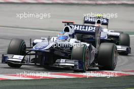 09.05.2010 Barcelona, Spain,  Rubens Barrichello (BRA), Williams F1 Team leads Nico Hulkenberg (GER), Williams F1 Team - Formula 1 World Championship, Rd 5, Spanish Grand Prix, Sunday Race