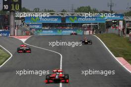 09.05.2010 Barcelona, Spain,  Lucas di Grassi (BRA), Virgin Racing, Sebastian Vettel (GER), Red Bull Racing and Lewis Hamilton (GBR), McLaren Mercedes goes out of the pits - Formula 1 World Championship, Rd 5, Spanish Grand Prix, Sunday Race