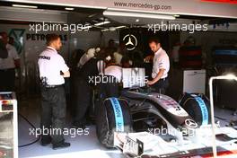 08.05.2010 Barcelona, Spain,  Mechanics looking at Michael Schumacher (GER), Mercedes GP Petronas car - Formula 1 World Championship, Rd 5, Spanish Grand Prix, Saturday Practice
