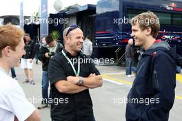 06.05.2010 Barcelona, Spain,  Randy Mamola (USA) Motor bike rider with Sebastian Vettel (GER), Red Bull Racing - Formula 1 World Championship, Rd 5, Spanish Grand Prix, Thursday
