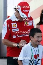 25.06.2010 Valencia, Spain,  Fernando Alonso (ESP), Scuderia Ferrari signs an autograph - Formula 1 World Championship, Rd 9, European Grand Prix, Friday