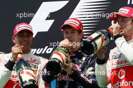 27.06.2010 Valencia, Spain,  Lewis Hamilton (GBR), McLaren Mercedes with 1st place Sebastian Vettel (GER), Red Bull Racing and 3rd place Jenson Button (GBR), McLaren Mercedes - Formula 1 World Championship, Rd 9, European Grand Prix, Sunday Podium