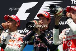 27.06.2010 Valencia, Spain,  Lewis Hamilton (GBR), McLaren Mercedes with 1st place Sebastian Vettel (GER), Red Bull Racing and 3rd place Jenson Button (GBR), McLaren Mercedes - Formula 1 World Championship, Rd 9, European Grand Prix, Sunday Podium