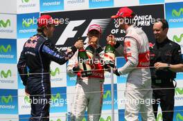 27.06.2010 Valencia, Spain,  Lewis Hamilton (GBR), McLaren Mercedes with 1st place Sebastian Vettel (GER), Red Bull Racing and 3rd place Jenson Button (GBR), McLaren Mercedes - Formula 1 World Championship, Rd 9, European Grand Prix, Sunday Podium