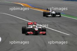 27.06.2010 Valencia, Spain,  Lewis Hamilton (GBR), McLaren Mercedes goes out of the pits after the drive through - Formula 1 World Championship, Rd 9, European Grand Prix, Sunday Race