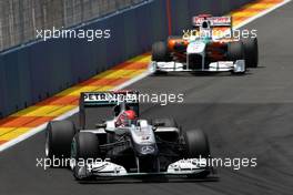 27.06.2010 Valencia, Spain,  Michael Schumacher (GER), Mercedes GP Petronas leads Adrian Sutil (GER), Force India F1 Team - Formula 1 World Championship, Rd 9, European Grand Prix, Sunday Race