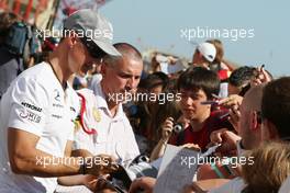 24.06.2010 Valencia, Spain,  Michael Schumacher (GER), Mercedes GP Petronas signs autographs - Formula 1 World Championship, Rd 9, European Grand Prix, Thursday