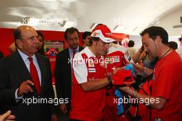 24.06.2010 Valencia, Spain,  Emilio Botín, chairman of Banco Santander and Fernando Alonso (ESP), Scuderia Ferrari - Formula 1 World Championship, Rd 9, European Grand Prix, Thursday