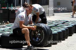 24.06.2010 Valencia, Spain,  Mclaren mechanic with a Bridgestone tyre - Formula 1 World Championship, Rd 9, European Grand Prix, Thursday