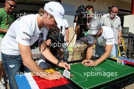 24.06.2010 Valencia, Spain,  Nico Rosberg (GER), Mercedes GP Petronas and Michael Schumacher (GER), Mercedes GP Petronas play table football - Formula 1 World Championship, Rd 9, European Grand Prix, Thursday