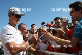 24.06.2010 Valencia, Spain,  Michael Schumacher (GER), Mercedes GP Petronas signs autographs  - Formula 1 World Championship, Rd 9, European Grand Prix, Thursday