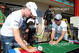 24.06.2010 Valencia, Spain,  Nico Rosberg (GER), Mercedes GP Petronas and Michael Schumacher (GER), Mercedes GP Petronas play table football - Formula 1 World Championship, Rd 9, European Grand Prix, Thursday