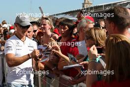 24.06.2010 Valencia, Spain,  Michael Schumacher (GER), Mercedes GP Petronas signs autographs - Formula 1 World Championship, Rd 9, European Grand Prix, Thursday