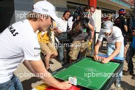 24.06.2010 Valencia, Spain,  Nico Rosberg (GER), Mercedes GP Petronas and Michael Schumacher (GER), Mercedes GP Petronas play table football - Formula 1 World Championship, Rd 9, European Grand Prix, Thursday