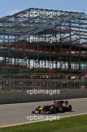 09.07.2010 Silverstone, England,  Mark Webber (AUS), Red Bull Racing in front of the new pit building - Formula 1 World Championship, Rd 10, British Grand Prix, Friday Practice