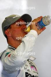 09.07.2010 Silverstone, England,  Michael Schumacher (GER), Mercedes GP Petronas takes a drink - Formula 1 World Championship, Rd 10, British Grand Prix, Friday Practice