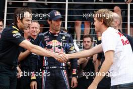 11.07.2010 Silverstone, England,  Red Bull team celebrate Mark Webbers win, Mark Webber (AUS), Red Bull Racing, Sebastian Vettel (GER), Red Bull Racing  - Formula 1 World Championship, Rd 10, British Grand Prix, Sunday Podium