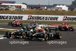 11.07.2010 Silverstone, England,  Heikki Kovalainen (FIN), Lotus F1 Team, Jarno Trulli (ITA), Lotus F1 Team, T127 - Formula 1 World Championship, Rd 10, British Grand Prix, Sunday Race