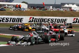 11.07.2010 Silverstone, England,  Michael Schumacher (GER), Mercedes GP Petronas, W01 leads Jenson Button (GBR), McLaren Mercedes - Formula 1 World Championship, Rd 10, British Grand Prix, Sunday Race