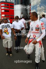 10.07.2010 Silverstone, England,  Nicholas Hamilton (GBR), Brother of Lewis Hamilton with Anthony Hamilton (GBR), Father of Lewis Hamilton and Lewis Hamilton (GBR), McLaren Mercedes - Formula 1 World Championship, Rd 10, British Grand Prix, Saturday