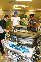 08.07.2010 Silverstone, England,  Bruno Senna (BRA), Hispania Racing F1 Team HRT and Karun Chandhok (IND), Hispania Racing F1 Team HRT, visit of the Cosworth factory in Northhampton - Formula 1 World Championship, Rd 10, British Grand Prix, Thursday