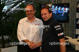 23.07.2010 Hockenheim, Germany,  Dermot Boden, Chief Marketing Officer for LG Electronics shakes hands with Christian Horner (GBR), Red Bull Racing, Sporting Director after announcing a deal with LG and Redbull - Formula 1 World Championship, Rd 11, German Grand Prix, Friday