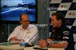 23.07.2010 Hockenheim, Germany,  Dermot Boden, Chief Marketing Officer for LG Electronics shakes hands with Christian Horner (GBR), Red Bull Racing, Sporting Director after announcing a deal with LG and Redbull - Formula 1 World Championship, Rd 11, German Grand Prix, Friday