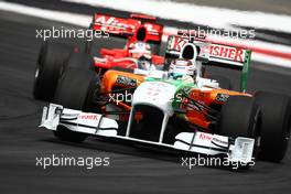 25.07.2010 Hockenheim, Germany,  Adrian Sutil (GER), Force India F1 Team leads Timo Glock (GER), Virgin Racing - Formula 1 World Championship, Rd 11, German Grand Prix, Sunday Race