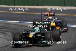25.07.2010 Hockenheim, Germany,  Heikki Kovalainen (FIN), Lotus F1 Team, T127 leads Sebastian Vettel (GER), Red Bull Racing, RB6 - Formula 1 World Championship, Rd 11, German Grand Prix, Sunday Race
