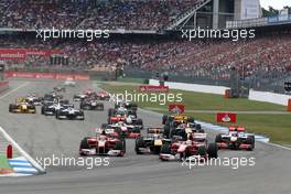 25.07.2010 Hockenheim, Germany,  Felipe Massa (BRA), Scuderia Ferrari leads Fernando Alonso (ESP), Scuderia Ferrari and Sebastian Vettel (GER), Red Bull Racing at the start - Formula 1 World Championship, Rd 11, German Grand Prix, Sunday Race