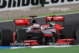25.07.2010 Hockenheim, Germany,  Jenson Button (GBR), McLaren Mercedes leads Lucas di Grassi (BRA), Virgin Racing - Formula 1 World Championship, Rd 11, German Grand Prix, Sunday Race