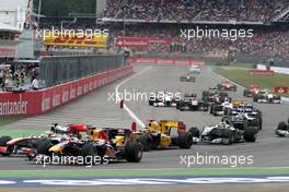 25.07.2010 Hockenheim, Germany,  Lewis Hamilton (GBR), McLaren Mercedes and Mark Webber (AUS), Red Bull Racing at the start - Formula 1 World Championship, Rd 11, German Grand Prix, Sunday Race