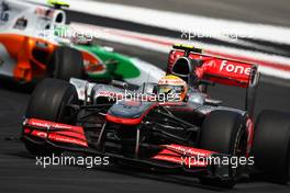 25.07.2010 Hockenheim, Germany,  Lewis Hamilton (GBR), McLaren Mercedes leads Vitantonio Liuzzi (ITA), Force India F1 Team - Formula 1 World Championship, Rd 11, German Grand Prix, Sunday Race