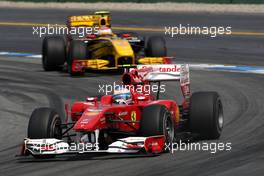 25.07.2010 Hockenheim, Germany,  Fernando Alonso (ESP), Scuderia Ferrari, F10 leads Vitaly Petrov (RUS), Renault F1 Team, R30 - Formula 1 World Championship, Rd 11, German Grand Prix, Sunday Race