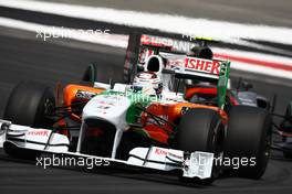 25.07.2010 Hockenheim, Germany,  Adrian Sutil (GER), Force India F1 Team leads Sakon Yamamoto (JPN), Hispania Racing F1 Team HRT - Formula 1 World Championship, Rd 11, German Grand Prix, Sunday Race