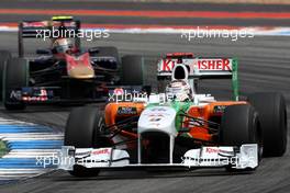 25.07.2010 Hockenheim, Germany,  Adrian Sutil (GER), Force India F1 Team, VJM-02 leads Jaime Alguersuari (ESP), Scuderia Toro Rosso, STR05 - Formula 1 World Championship, Rd 11, German Grand Prix, Sunday Race