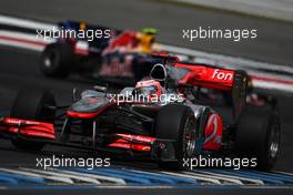 25.07.2010 Hockenheim, Germany,  Jenson Button (GBR), McLaren Mercedes leads Mark Webber (AUS), Red Bull Racing - Formula 1 World Championship, Rd 11, German Grand Prix, Sunday Race