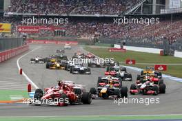 25.07.2010 Hockenheim, Germany,  Felipe Massa (BRA), Scuderia Ferrari leads Fernando Alonso (ESP), Scuderia Ferrari and Sebastian Vettel (GER), Red Bull Racing at the start - Formula 1 World Championship, Rd 11, German Grand Prix, Sunday Race