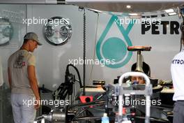 22.07.2010 Mannheim, Germany,  Michael Schumacher (GER), Mercedes GP Petronas takes a look at his car - Formula 1 World Championship, Rd 11, German Grand Prix, Thursday