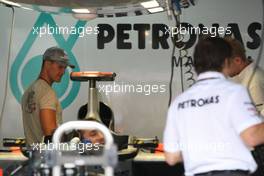 22.07.2010 Mannheim, Germany,  Michael Schumacher (GER), Mercedes GP Petronas takes a look at his car - Formula 1 World Championship, Rd 11, German Grand Prix, Thursday