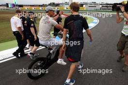 22.07.2010 Mannheim, Germany,  Michael Schumacher (GER), Mercedes GP Petronas takes a look at the track and chats with Sebastian Vettel (GER), Red Bull Racing as he walks the track - Formula 1 World Championship, Rd 11, German Grand Prix, Thursday