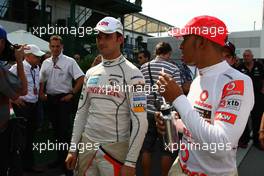 30.07.2010 Budapest, Hungary,  Vitantonio Liuzzi (ITA), Force India F1 Team and Lewis Hamilton (GBR), McLaren Mercedes - Formula 1 World Championship, Rd 12, Hungarian Grand Prix, Friday