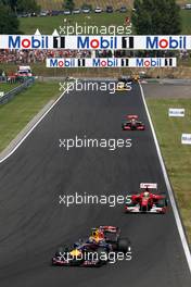 01.08.2010 Budapest, Hungary,  Mark Webber (AUS), Red Bull Racing, RB6 leads Felipe Massa (BRA), Scuderia Ferrari, F10  - Formula 1 World Championship, Rd 12, Hungarian Grand Prix, Sunday Race