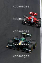 01.08.2010 Budapest, Hungary,  Heikki Kovalainen (FIN), Lotus F1 Team, T127 leads Timo Glock (GER), Virgin Racing VR-01 - Formula 1 World Championship, Rd 12, Hungarian Grand Prix, Sunday Race