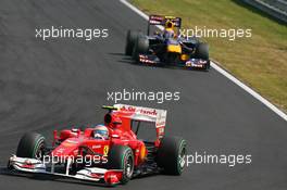 01.08.2010 Budapest, Hungary,  Fernando Alonso (ESP), Scuderia Ferrari leads Mark Webber (AUS), Red Bull Racing - Formula 1 World Championship, Rd 12, Hungarian Grand Prix, Sunday Race